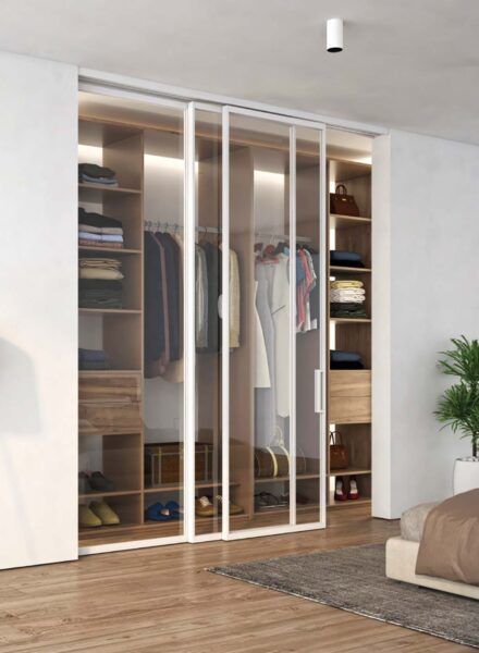 Velo Visioni - Porta doppia scorrevole in vetro a soffitto Velo Visioni - Porta doppia scorrevole in vetro a soffitto